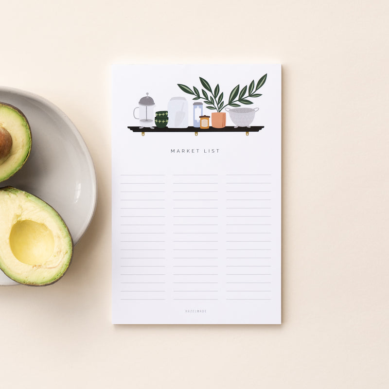 A single 5.5” by 8.5” large notepad with 50 tear-off sheets, an illustration of a shelf with common kitchen items on it, and text that reads "Market List".