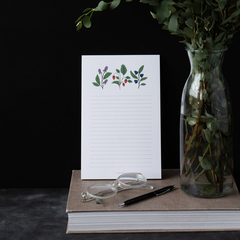 A single 5.5” by 8.5” large notepad with 50 tear-off sheets and an illustration of blackberries, strawberries, and blueberries.