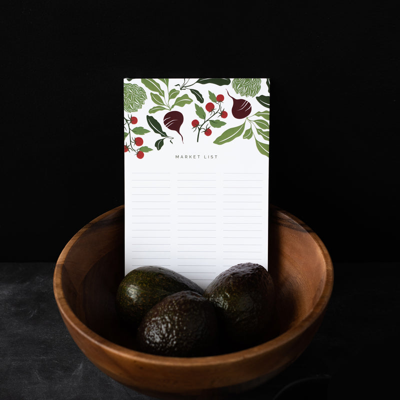 A single 5.5” by 8.5” large notepad with 50 tear-off sheets, an illustration of vegetables, and text that reads "Market List".