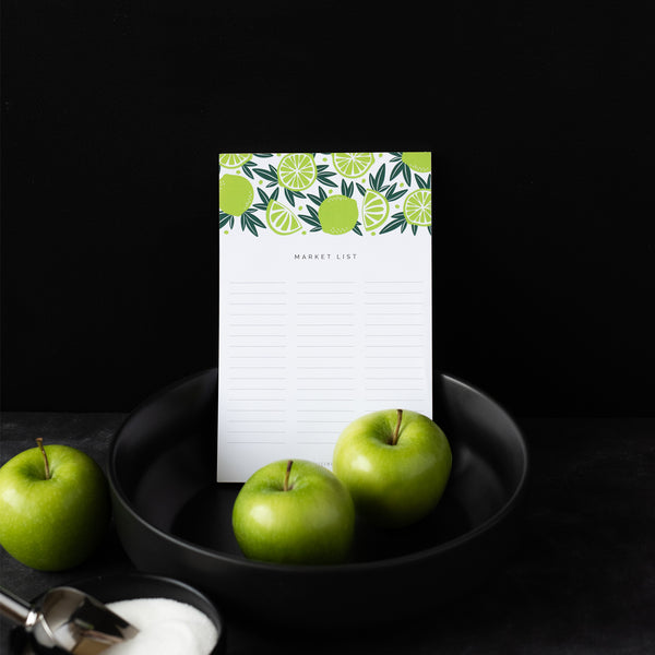 A single 5.5” by 8.5” large notepad with 50 tear-off sheets, an illustration of limes, and text that reads "Market List".