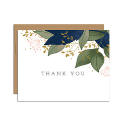 Single folded A2 greeting card with an envelope with an illustration of blue and green leaves sprouting from the top right corner of the card. In the center is text that states "Thank You".