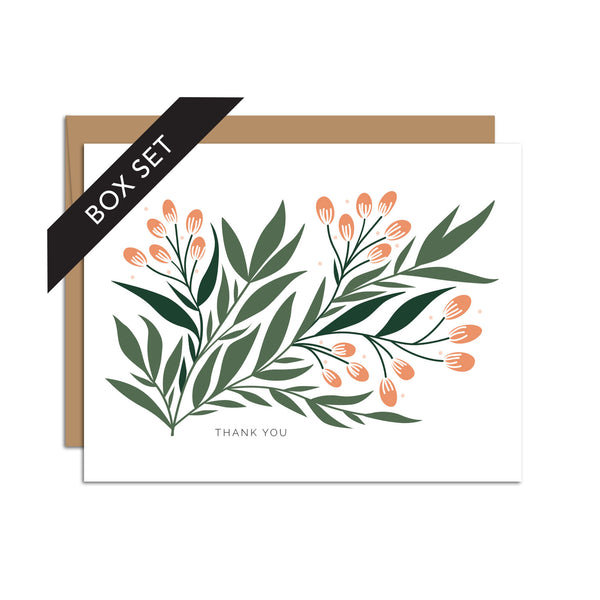 Box set of 8 folded A2 greeting cards with envelopes with an illustration   of a green branch with leaves and orange seeds. Text below the branch states "Thank You".