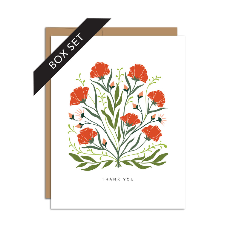 Box set of 8 folded A2 greeting cards with envelopes with an illustration  of red poppies and green leaves in the center of the card. Below is text that states "Thank You".
