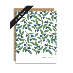 Box set of 8 folded A2 greeting cards with envelopes with an illustration   of blueberries and green leaves pattern. In the bottom right is text that states "Thank You".