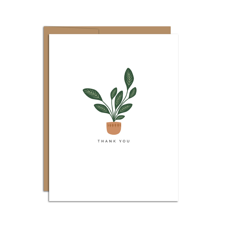 Single folded A2 greeting card with an envelope with an illustration of a singular house plant in a pot with text below it that states "Thank You".