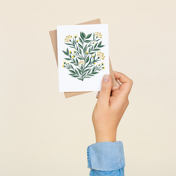 Single folded A2 greeting card with an envelope with an illustration of yellow aster flowers and green leaves.