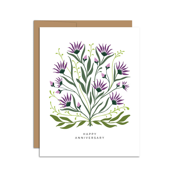 Single folded A2 greeting card with an envelope with an illustration of purple thistle and green leaves with text below it that states "Happy Anniversary".