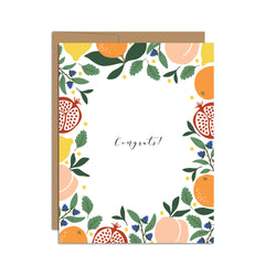 Single folded A2 greeting card with an envelope with an illustration of peaches, blueberries, lemons, pomegranates, and oranges bordering the edge of the card and the center stating "Congrats!".